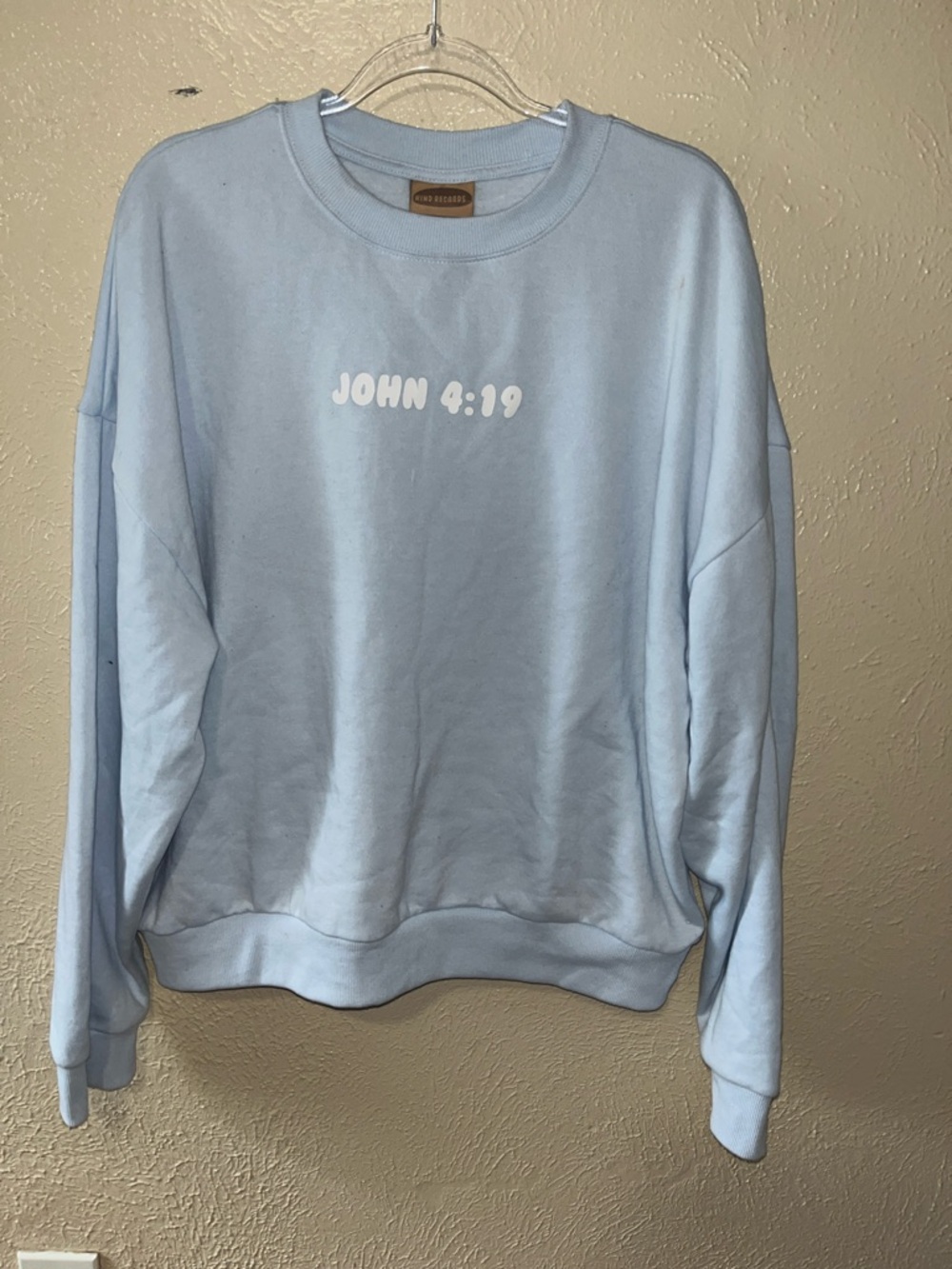 John 4:19 Light Blue Crewneck Sweatshirt